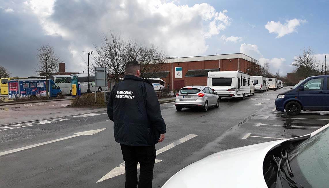 DCBL team member following vehicles pulling caravans