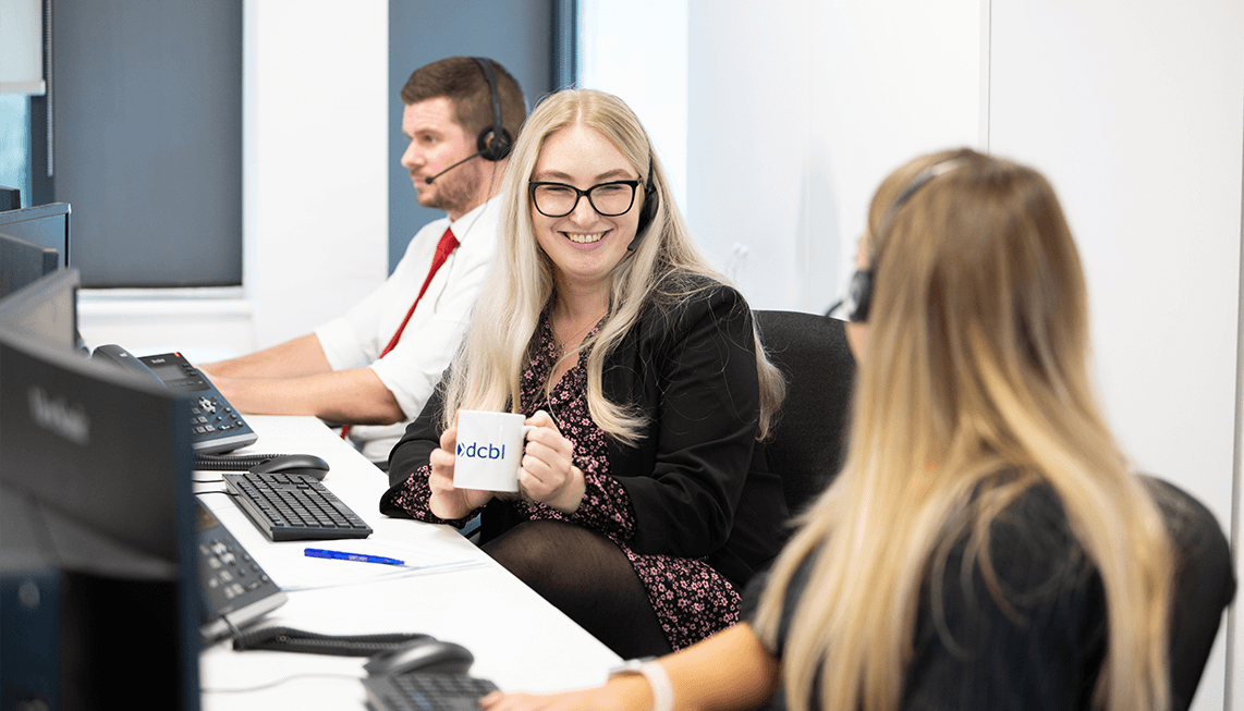 Three DCBL office staff at work